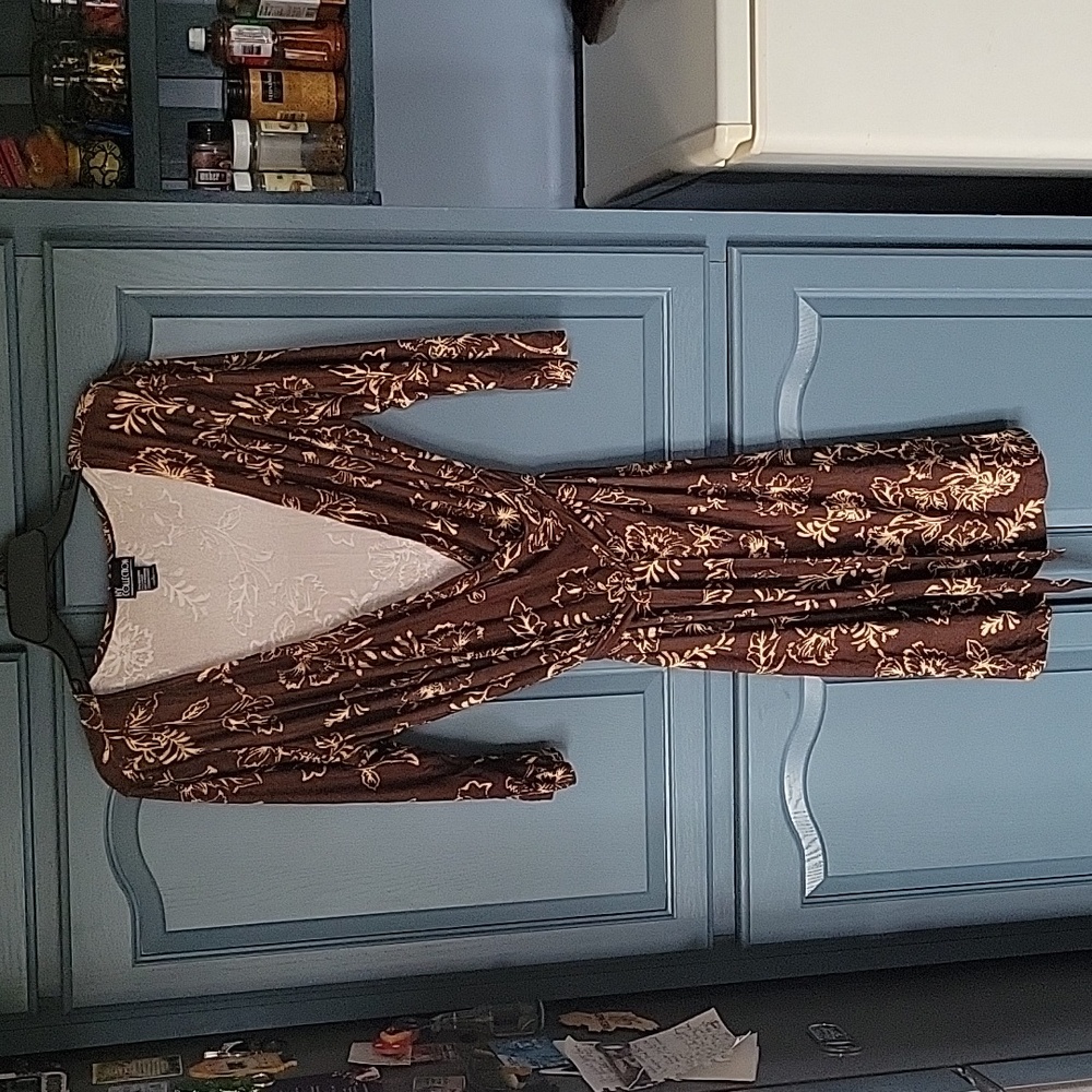 Like new beautiful dress. Stretchy and comfortable.  Belt